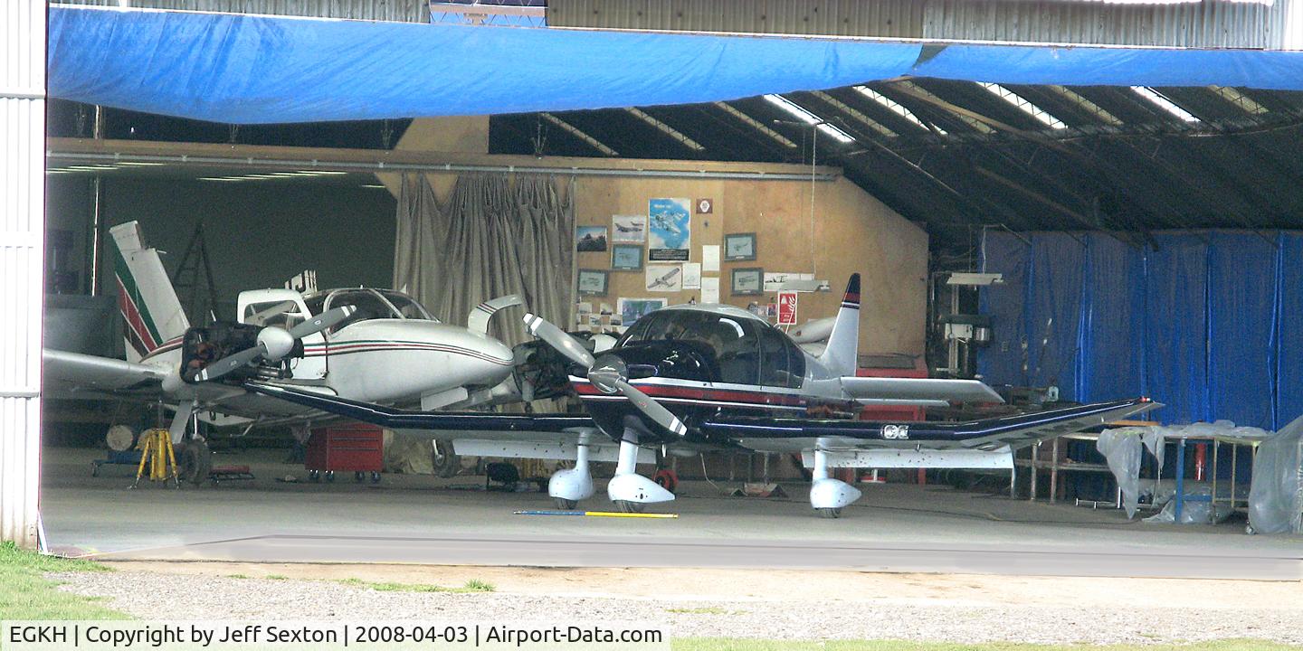 Lashenden/Headcorn Airport, Maidstone, England United Kingdom (EGKH) - Hangar Area at Lashenden/Headcorn UK (G-BCID - left & G-KENW - right)
