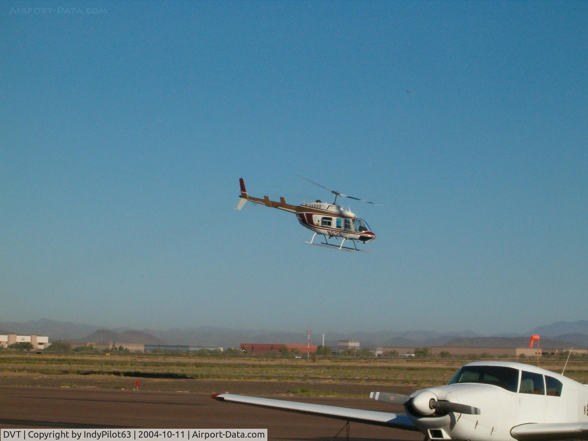 Phoenix Deer Valley Airport (DVT) - A Jet Ranger across the tarmac.