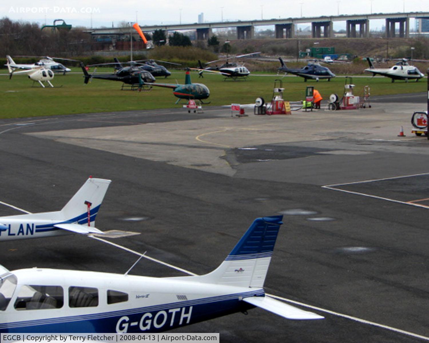 City Airport Manchester, Manchester, England United Kingdom (EGCB) - Despite the waterlogged airfield being closed to fixed wing traffic , 8 Helicopter vistors to Barton Airfield for the Manchester United v Arsenal Soccer match