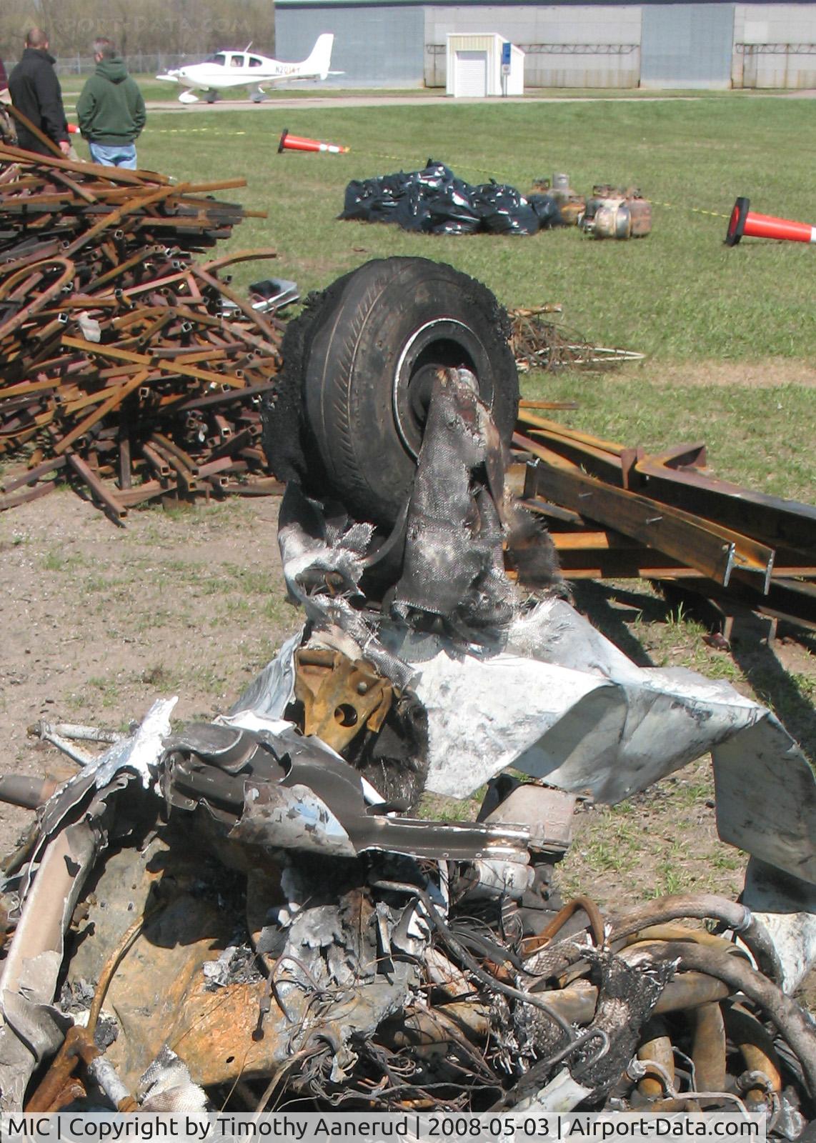 Crystal Airport (MIC) - The remains of a Piper PA-28 after a hangar fire.  Note the fiberglass cloth from the nose wheelpant survived, but the resin has melted away.