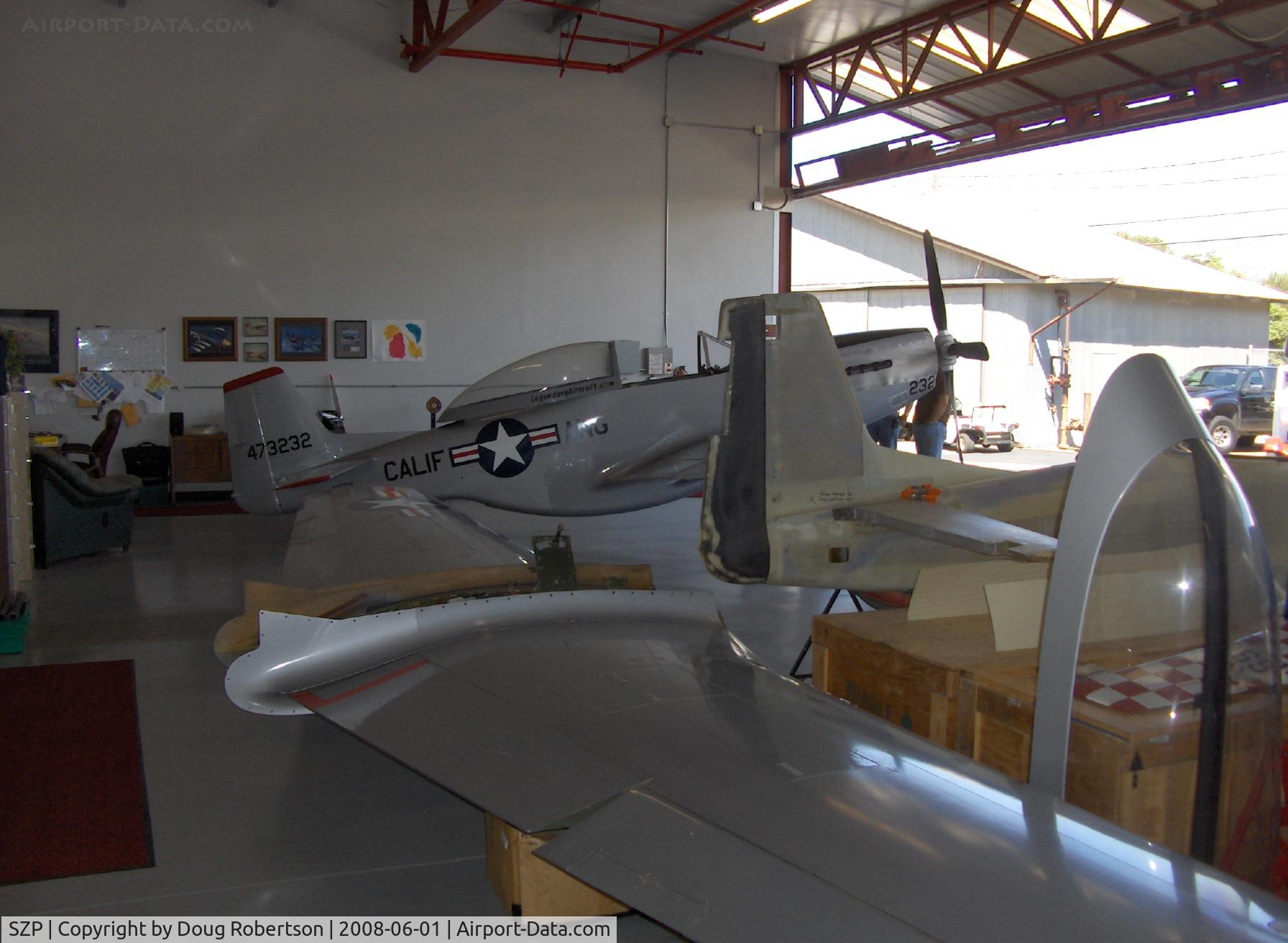 Santa Paula Airport (SZP) - Legendary Aircraft LLC, 70% scale P-51D MUSTANGS in Area 51. Molded composite construction. N151RK demonstrator aircraft in background.