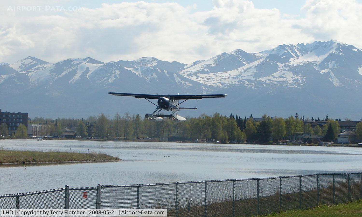Lake Hood Seaplane Base (LHD) - A DHC2 Beaver takes off from Spenard Lake end against a beautiful backdrop