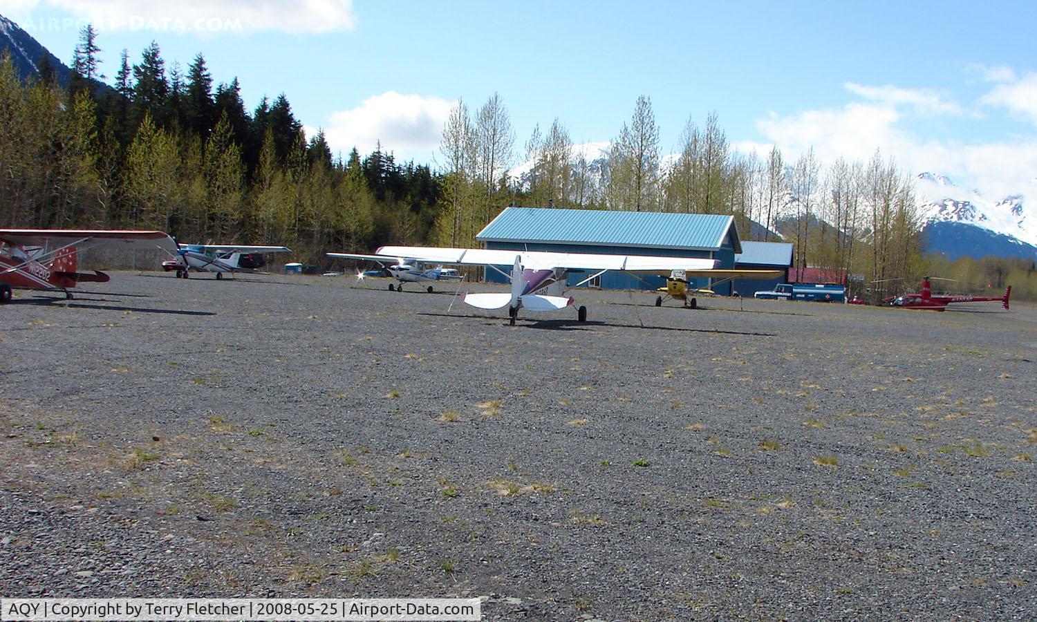 Girdwood Airport (AQY) - Looking on the North parking apron and Alpine Air helicopter facility