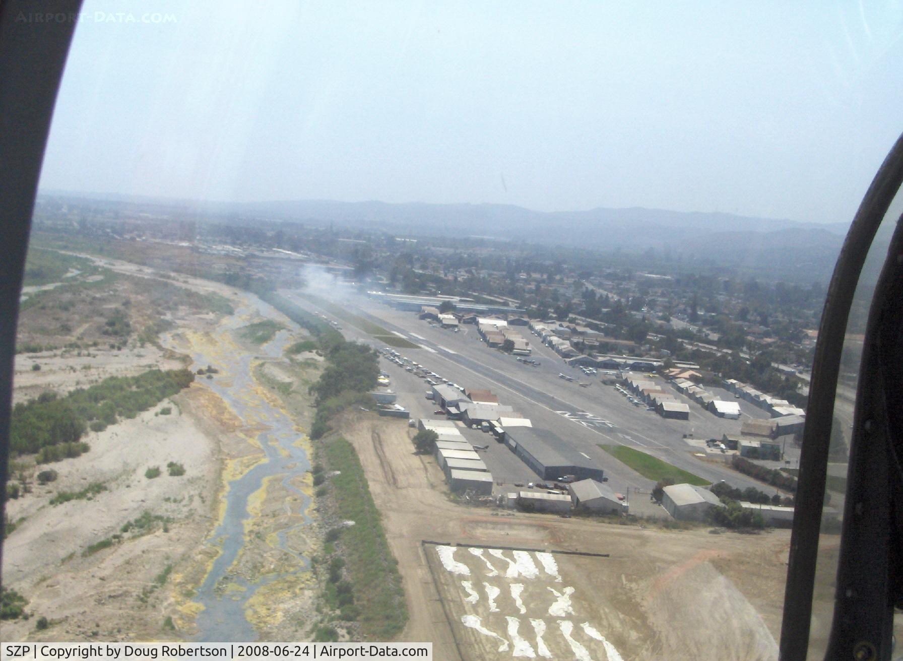 Santa Paula Airport (SZP) - On base leg for Rwy 22, off airport fire smoke in distance. Note: fire was burning brush, not an aircraft accident