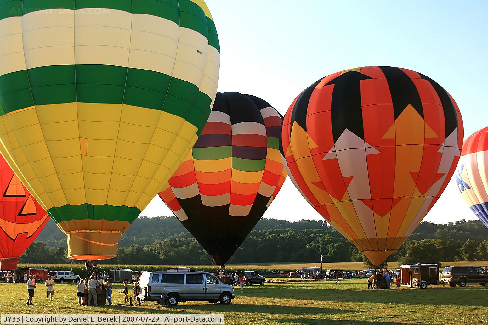 Harmony Balloonport (JY33) - A gaggle of balloons prepares for liftoff at the Warren County Fair.