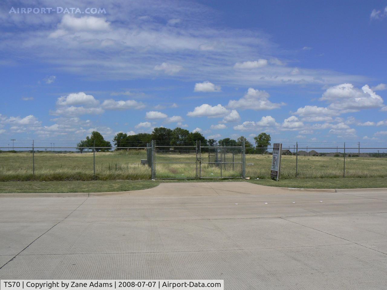 Jack Miller Airport (TS70) - Jack Miller Stolport - Now closed by encroachment and development land fenced and recently sold hanger removed. The only clue as to its former use is a windsock pole. 