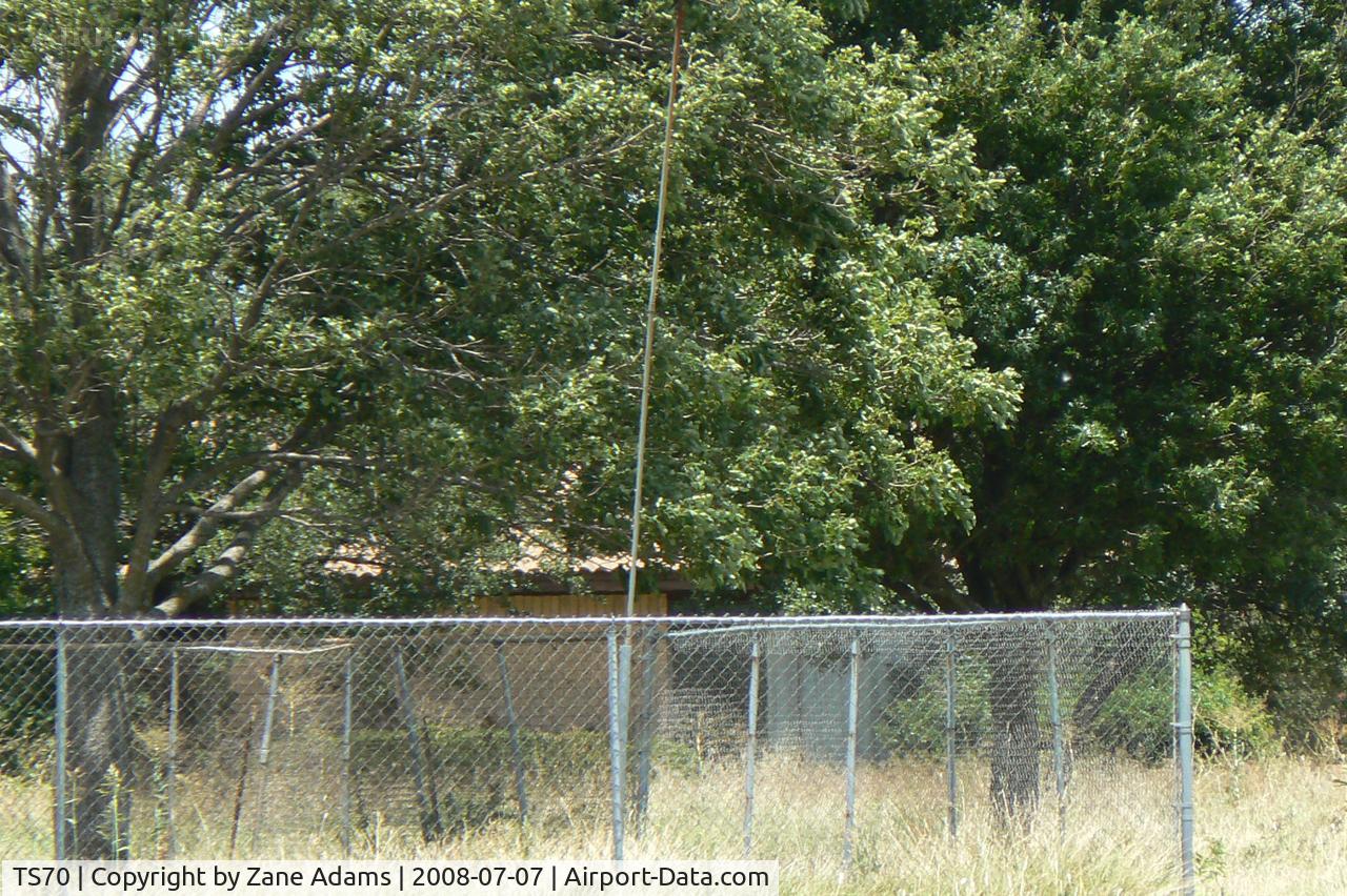 Jack Miller Airport (TS70) - Jack Miller Stolport - Now closed by encroachment and development land fenced and recently sold hanger removed. The only clue as to its former use is a windsock pole. 