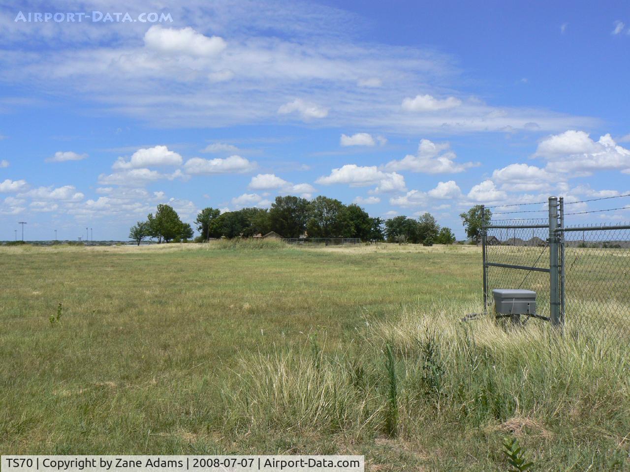 Jack Miller Airport (TS70) - Jack Miller Stolport - Now closed by encroachment and development land fenced and recently sold hanger removed. The only clue as to its former use is a windsock pole. 