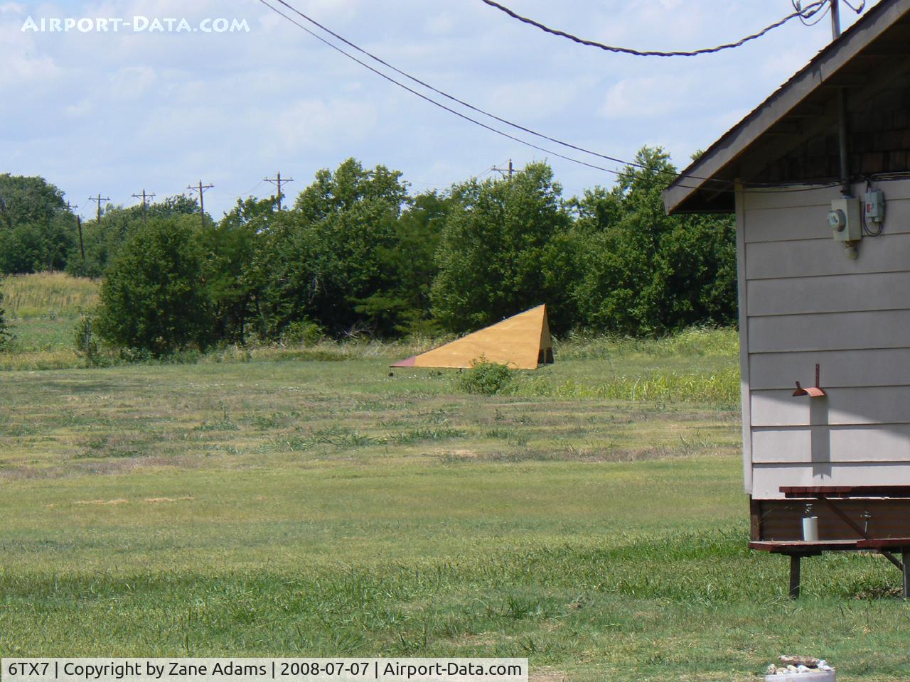 Flying L Airpark Airport (6TX7) - Flying L Private Strip - Unsure weather this airfield is still open. There is a fence and new subdivision of houses built with in yards of the hanger building, there was no airplane in the hanger and I could not see the runway
