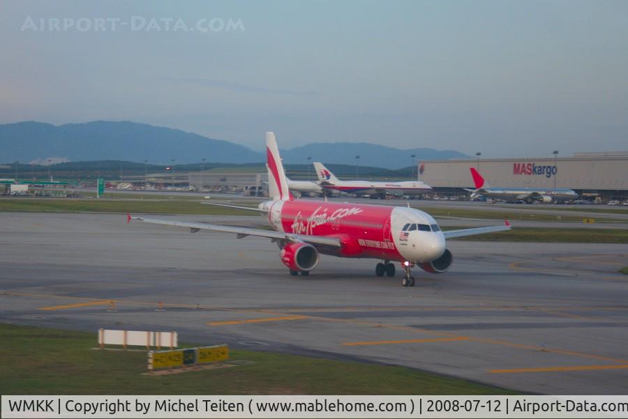 Kuala Lumpur International Airport, Sepang, Selangor Malaysia (WMKK) - AirAsia A320 taxiing near the Cargo Center