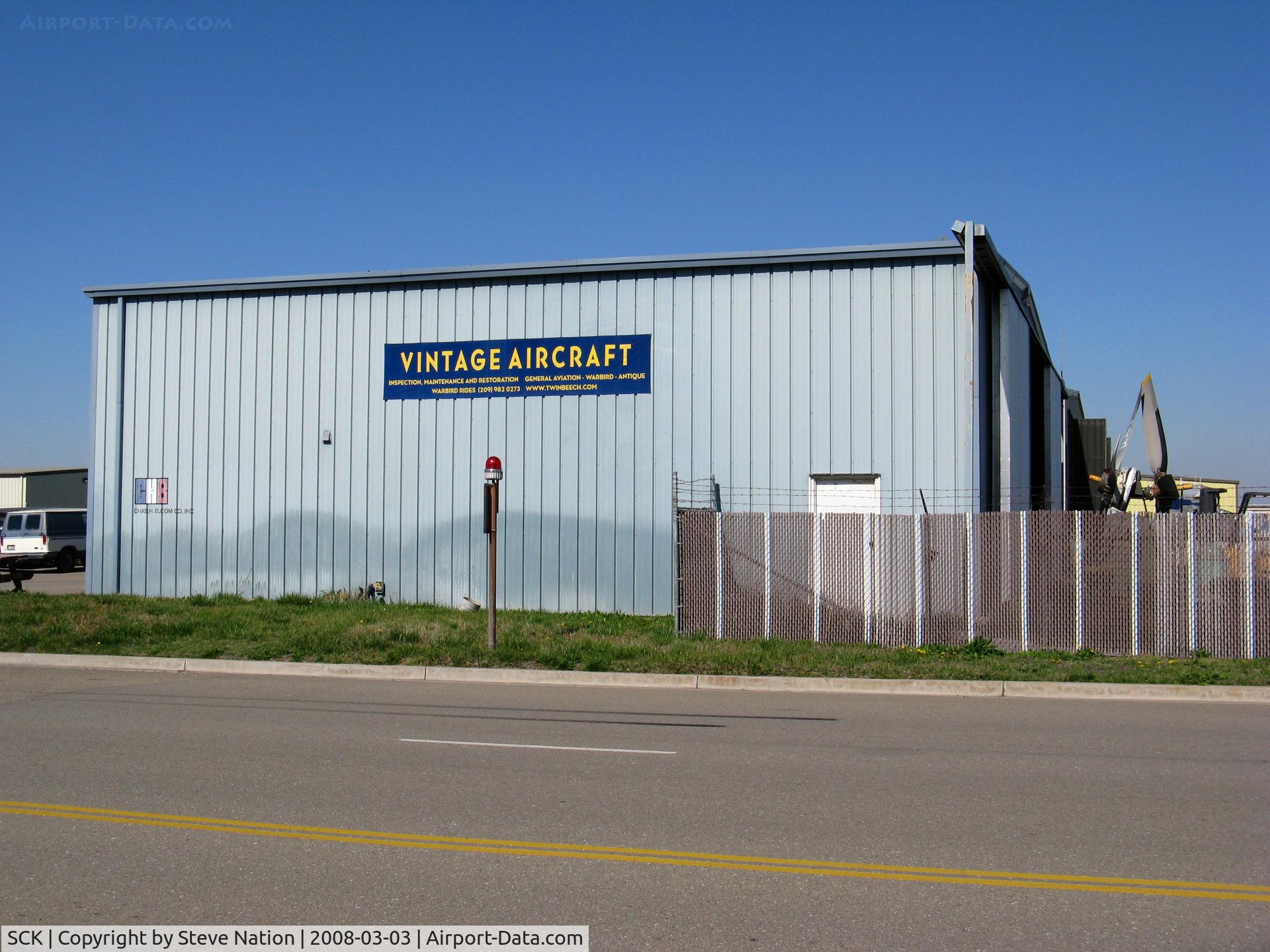 Stockton Metropolitan Airport (SCK) - Beech C-45 and Douglas a-26 specialist company Vintage Aircraft Co.'s main hangar