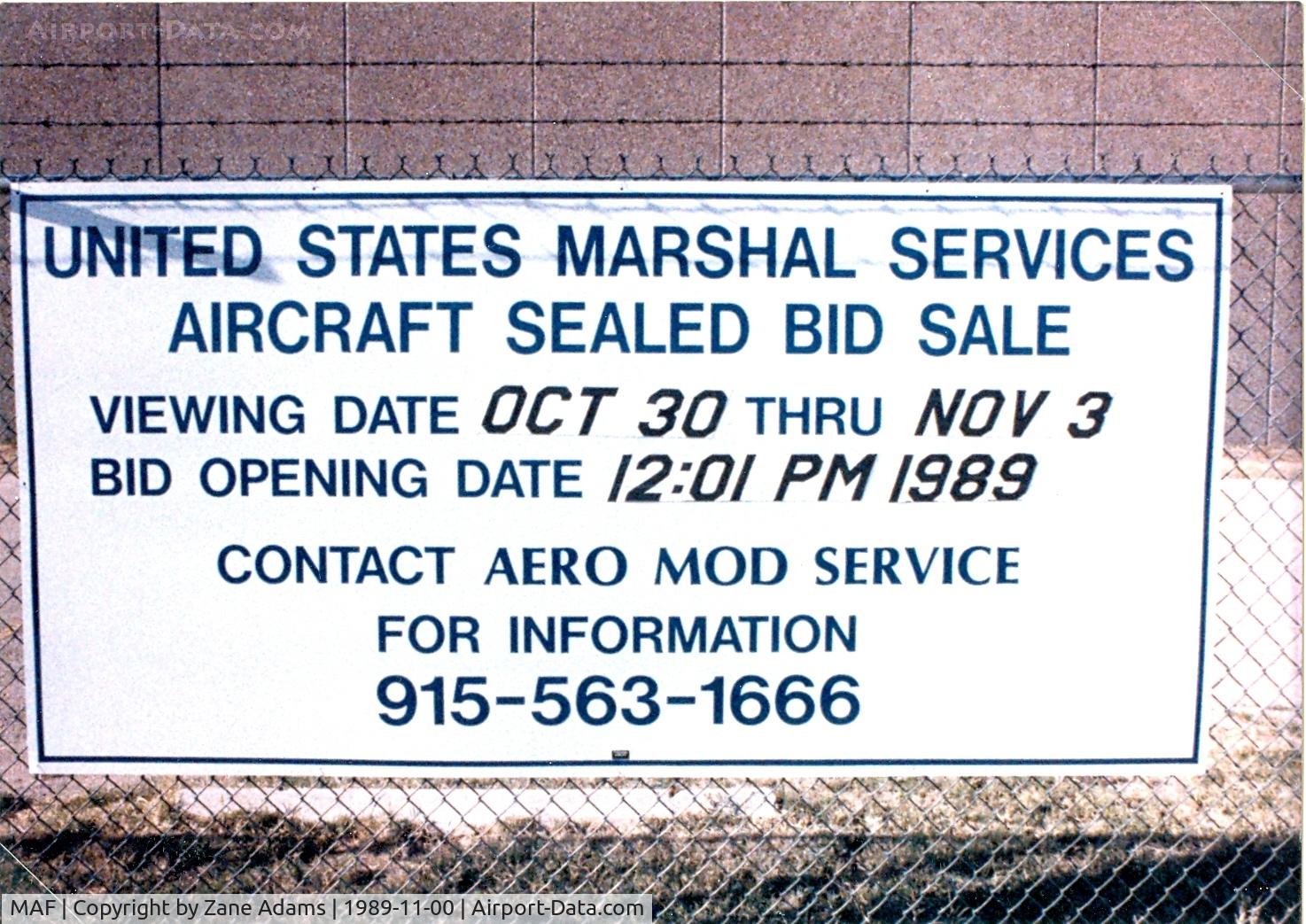 Midland International Airport (MAF) - Auction sign for aircraft at Midland (N7041U - N117GA among others)
