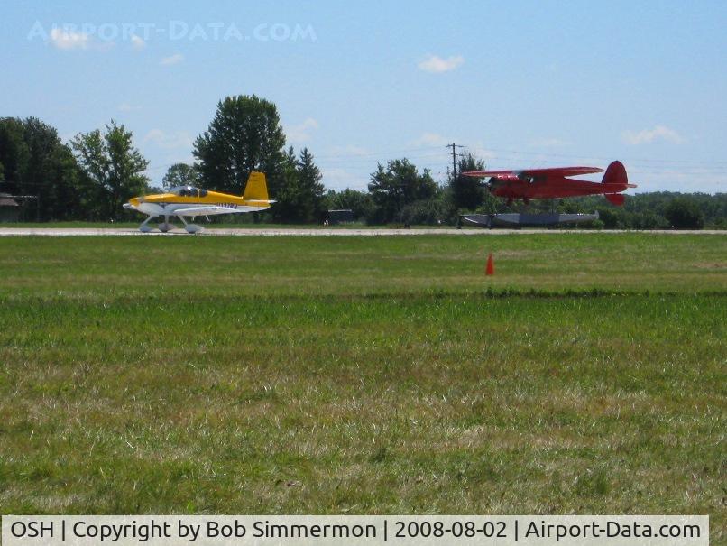 Wittman Regional Airport (OSH) - Launching two at a time on 36 at Airventure 2008.  N137RV (L) and N19498 (R).