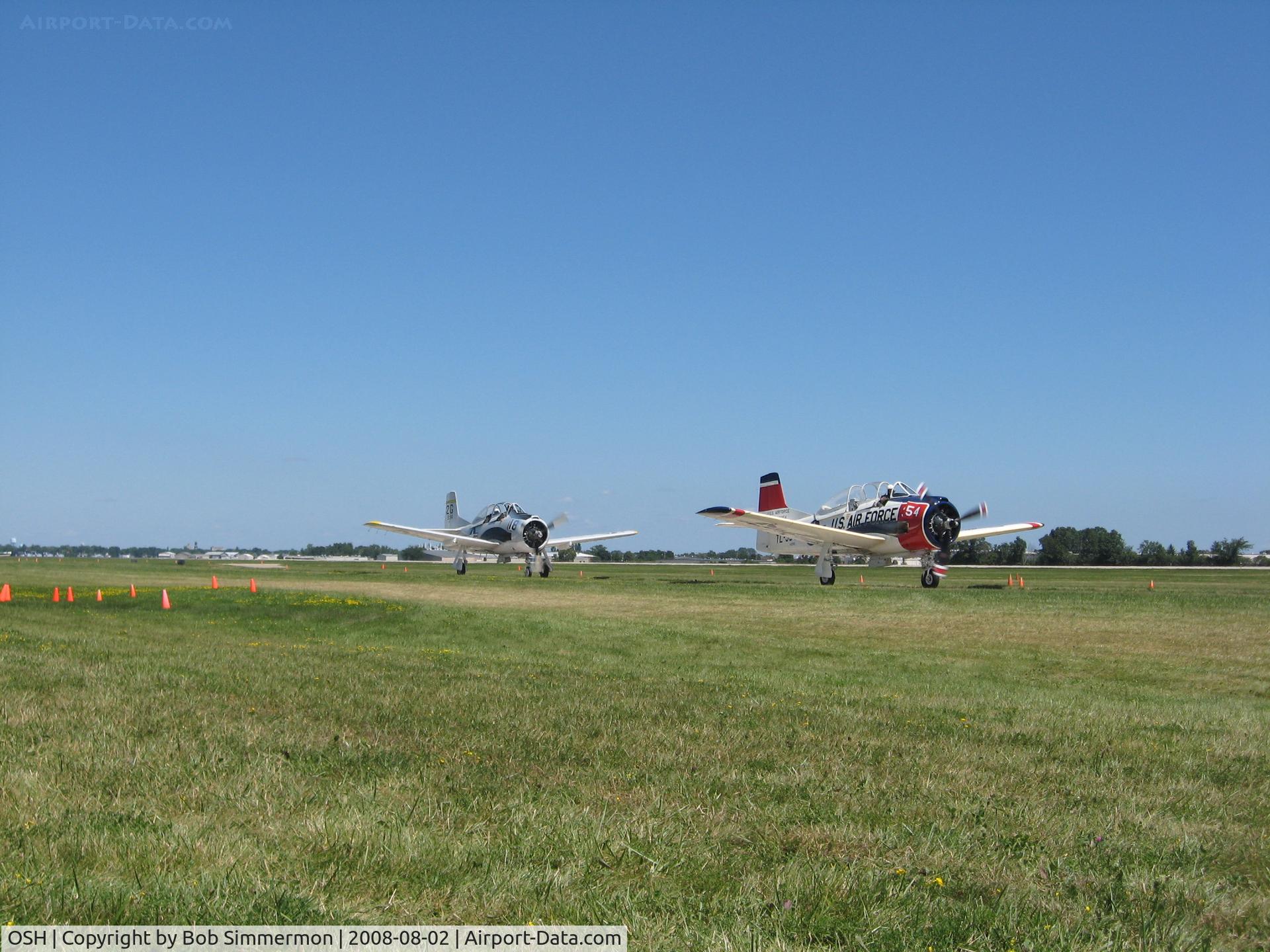 Wittman Regional Airport (OSH) - N194RR (L) and N1328B (R) taxiing to depart 36. Airventure 2008 - Oshkosh, WI