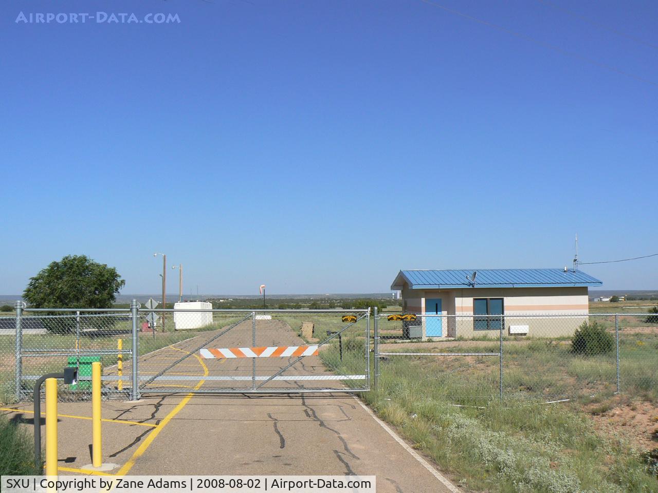 Santa Rosa Route 66 Airport (SXU) - Santa Rosa, New Mexico - new security fences and gate for an airport with no hangers, virtually no traffic and the only airplane on the airport is an ex-Air Force A-7 gate guard...More government time and money wasted...all to keep us 