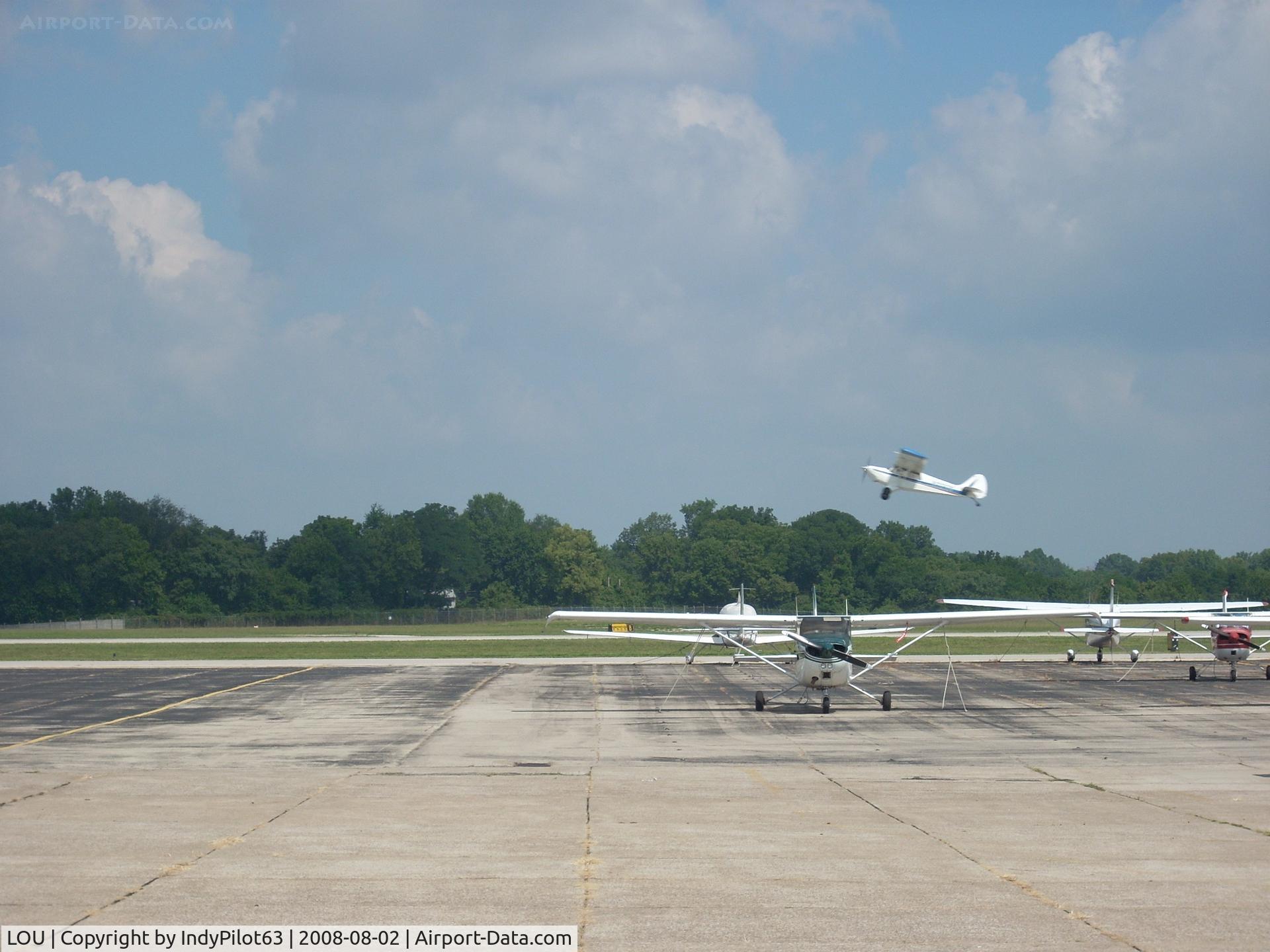 Bowman Field Airport (LOU) - A taildragger taking off from 24