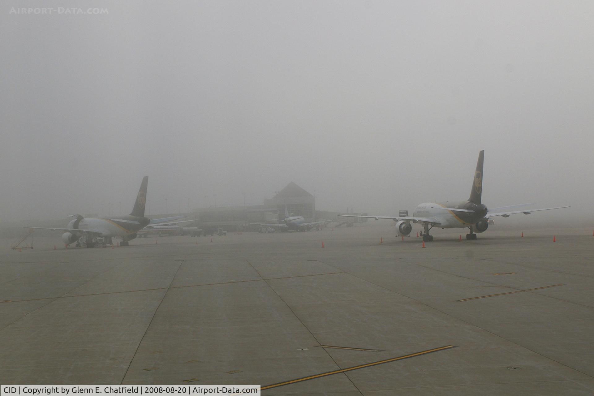 The Eastern Iowa Airport (CID) - Early morning fog and the UPS ramp with two 757s