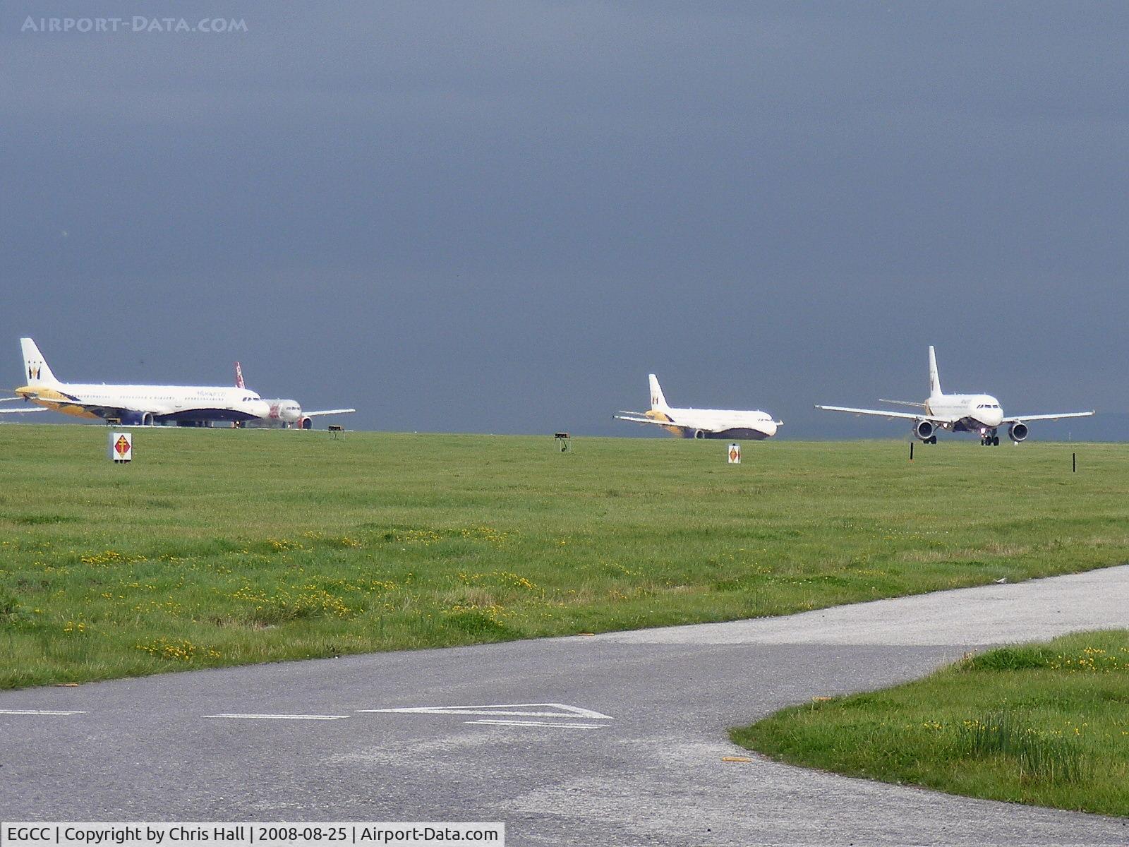 Manchester Airport, Manchester, England United Kingdom (EGCC) - Three Monarch Airbuses and a Jet2 Boeing 737 waiting to depart