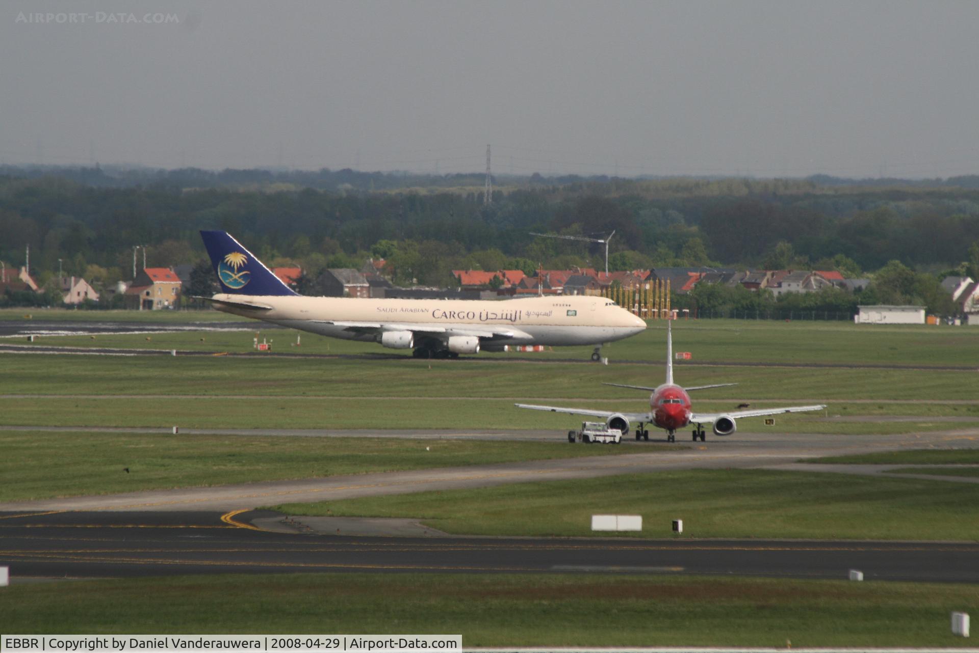 Brussels Airport, Brussels / Zaventem   Belgium (EBBR) - engines testing on 737-31S SX-BGY (interrupted) while Saudi cargo is taxiing to take off on rwy 25R
