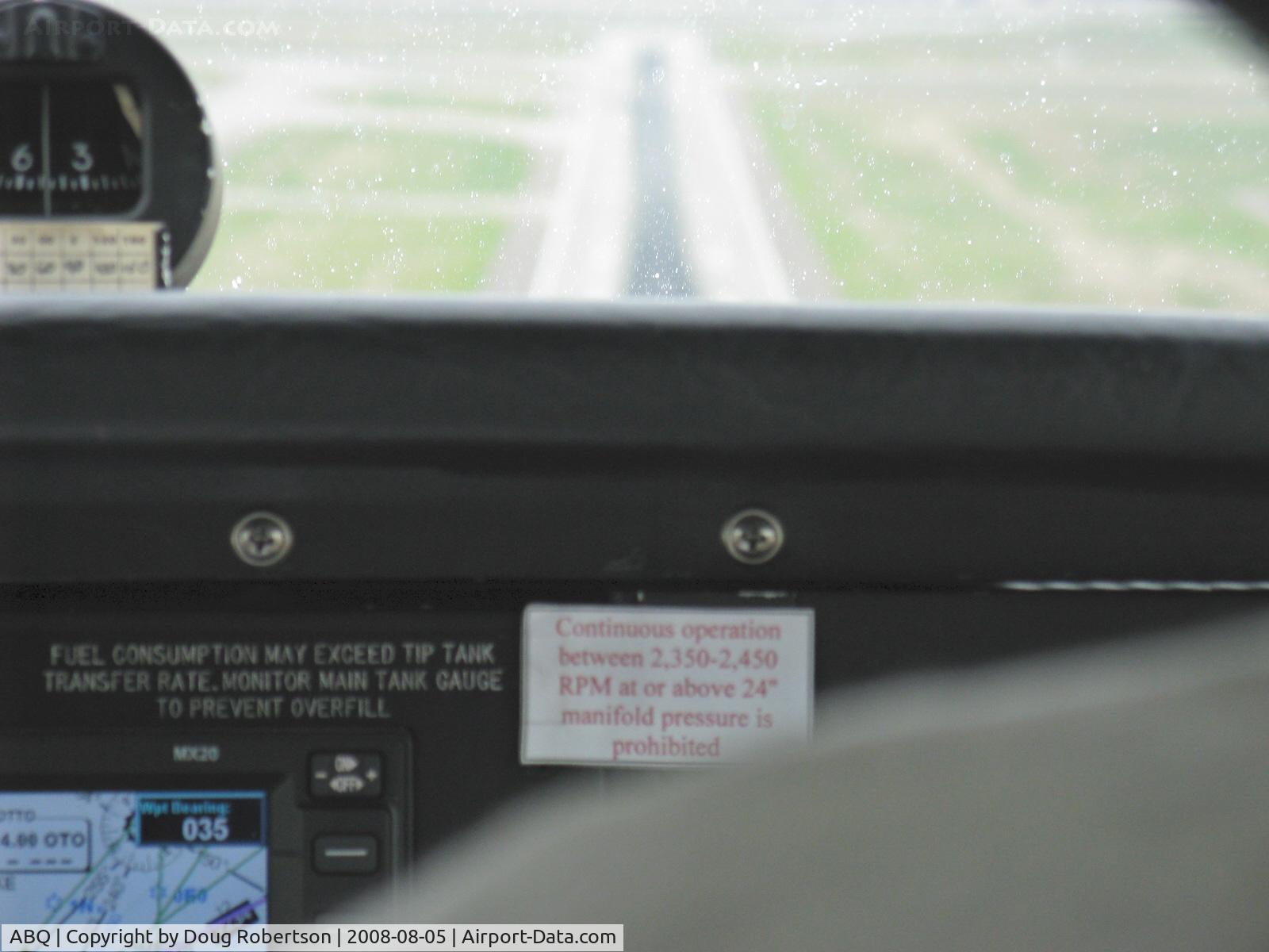 Albuquerque International Sunport Airport (ABQ) - On final Rwy 26 in N2111Q Beech BONANZA 36 descending through rain strata