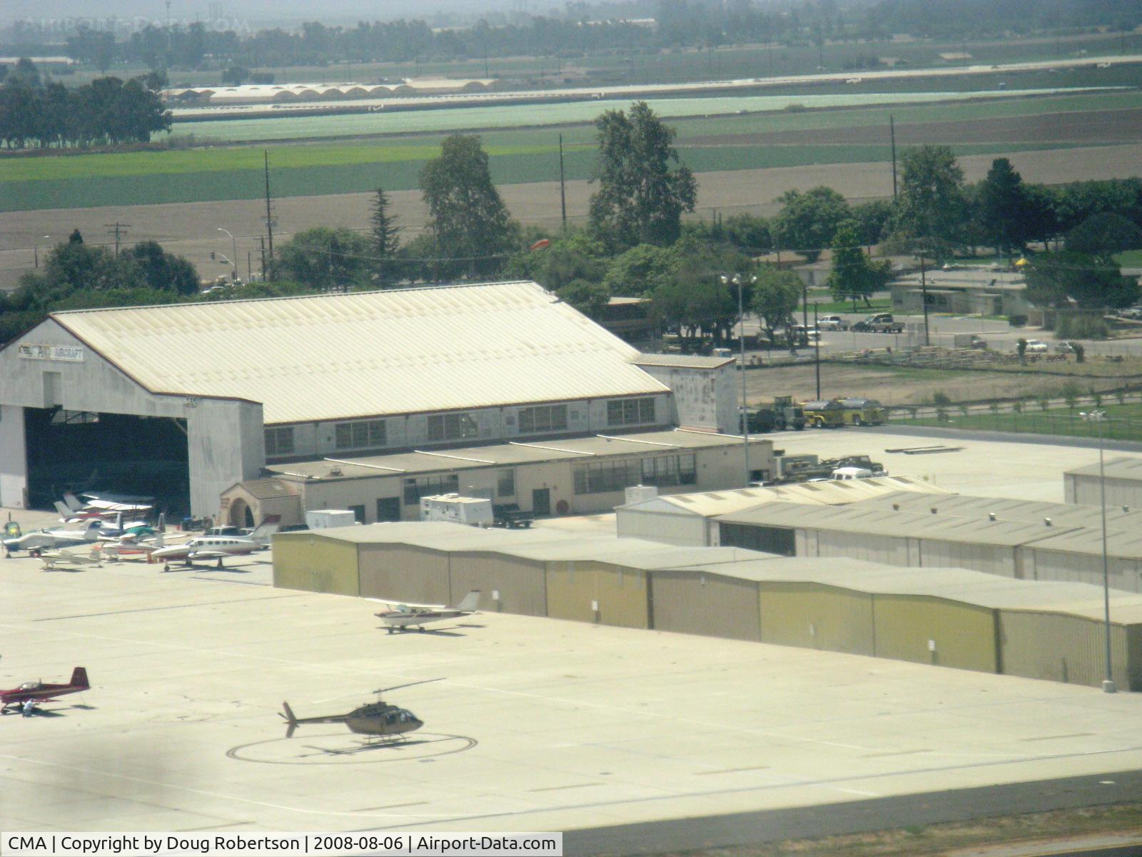 Camarillo Airport (CMA) - FBO hangar shared by Ventura County Sheriff Helicopter unit at west end, looking southwest from BONANZA N2111Q