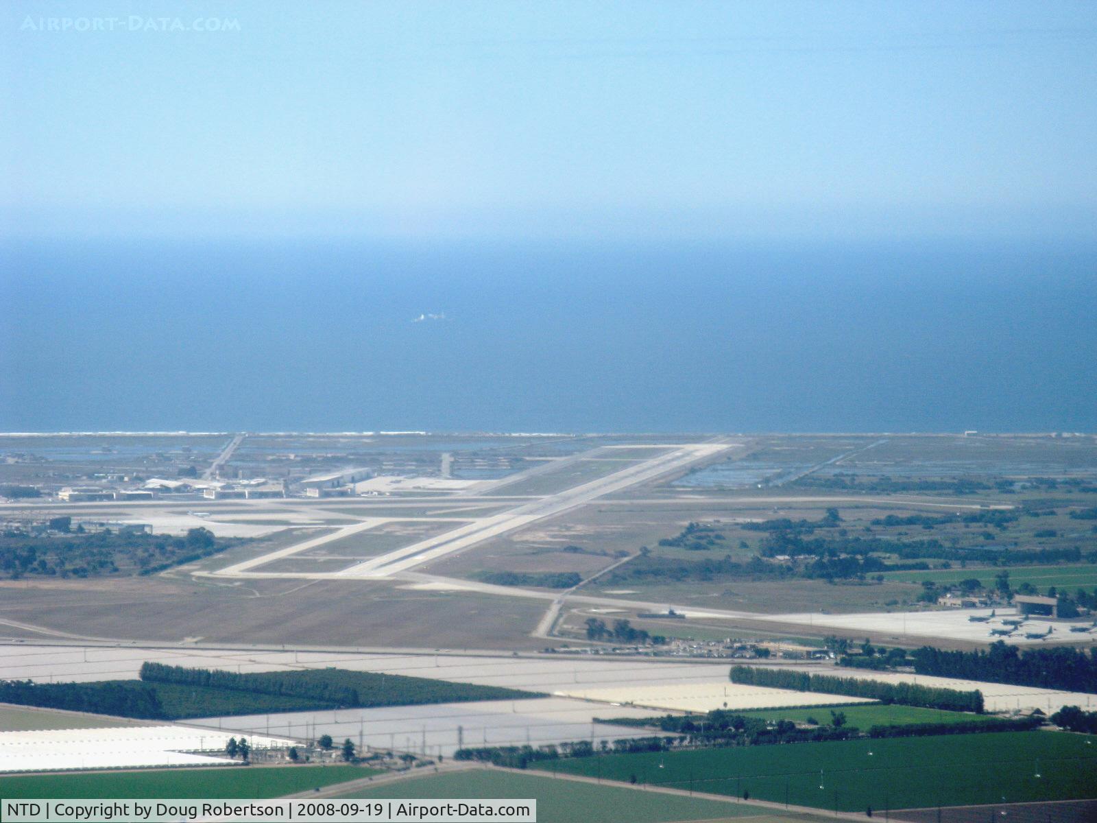 Point Mugu Nas (naval Base Ventura Co) Airport (NTD) - Naval Air Warfare Station, Point Mugu, California. Pacific Ocean beyond. Lower right portion shows Channel Islands Air National Guard taxiway and ramp who shares Point Mugu's two runways. Taken from RV-6, N406L.