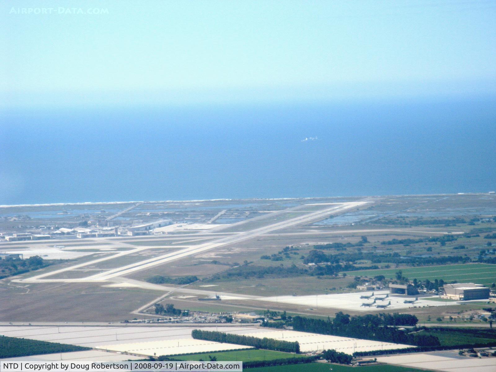 Point Mugu Nas (naval Base Ventura Co) Airport (NTD) - Naval Air Warfare Station, Point Mugu, California. Pacific Ocean beyond. Lower right portion shows Channel Islands Air National Guard taxiway and ramp who shares Pt. Mugu's two runways. Taken from RV-6 N406L.