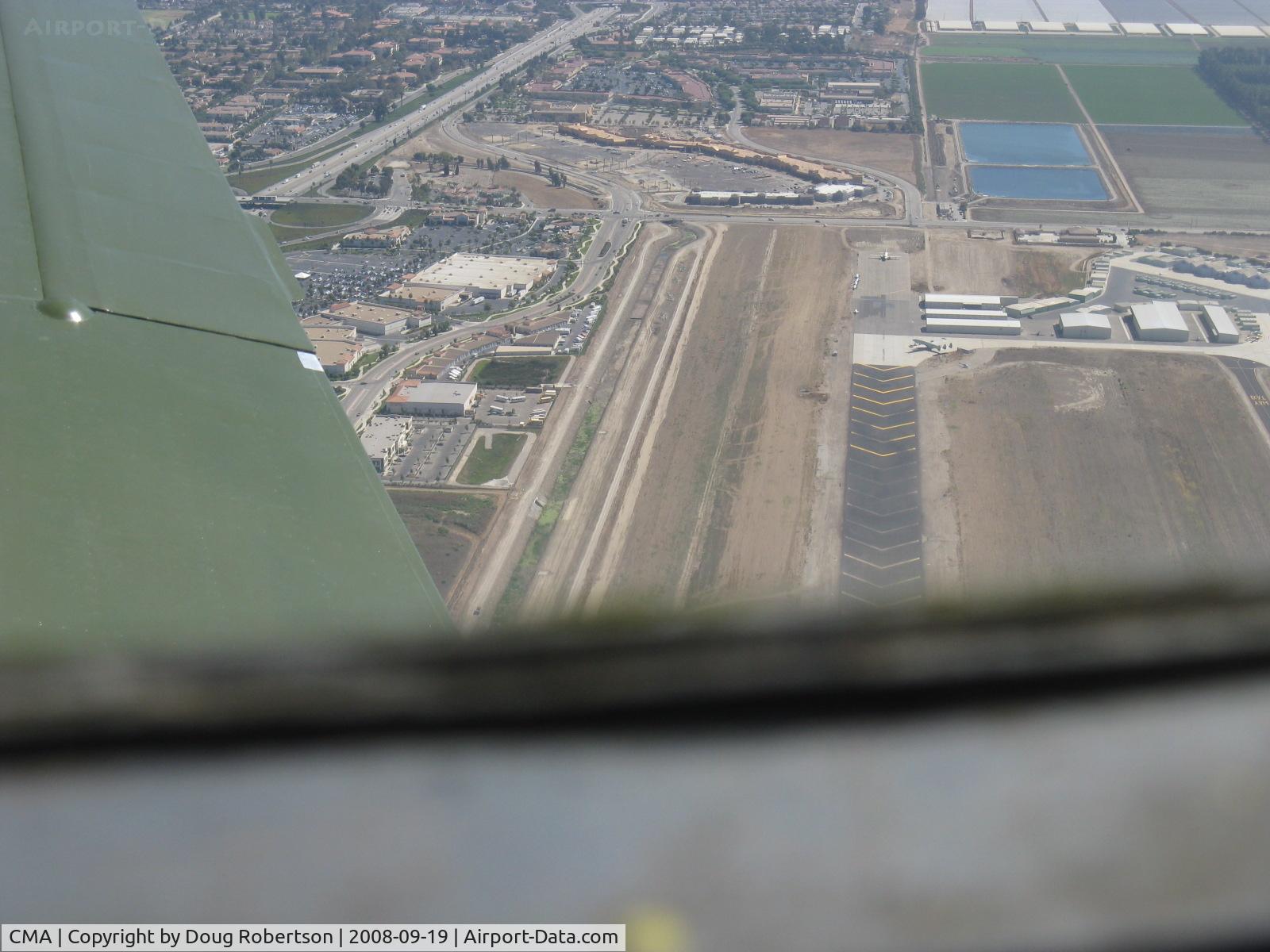 Camarillo Airport (CMA) - Displaced threshold chevron markings to 6,013' Rwy 26. Taken from well overhead runway from Beech 36 BONANZA