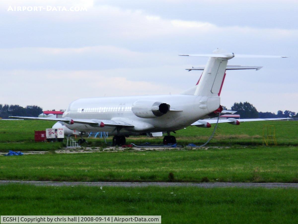 Norwich International Airport, Norwich, England United Kingdom (EGSH) - Fokker 100 stored at Norwich Airport