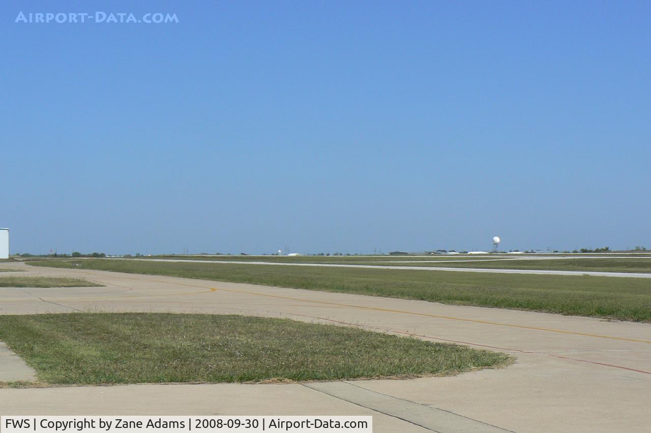 Fort Worth Spinks Airport (FWS) - Wide open spaces...looking north across the airfield...local Doppler RADAR dome on the east side of the field.
