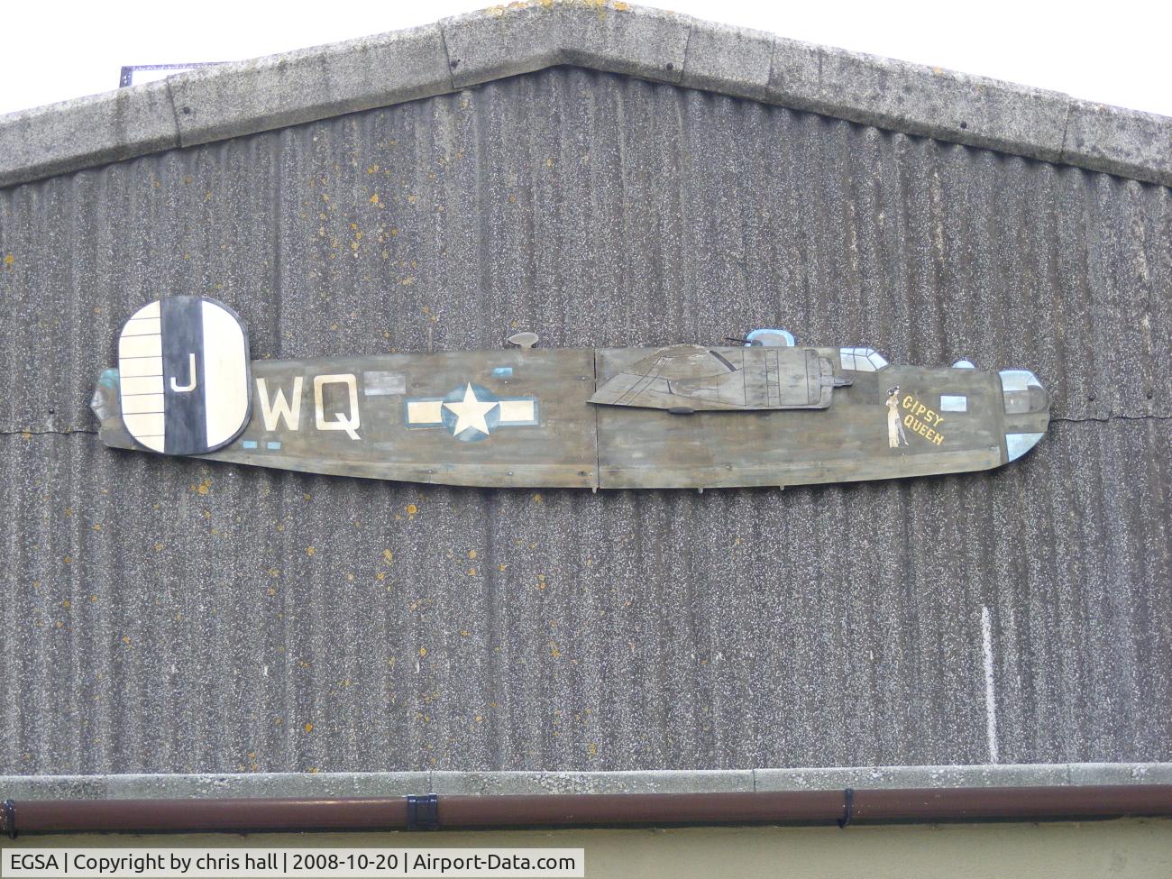 Shipdham Airport, Shipdham, England United Kingdom (EGSA) - B-24 on the side of the main hangar at Shipdham