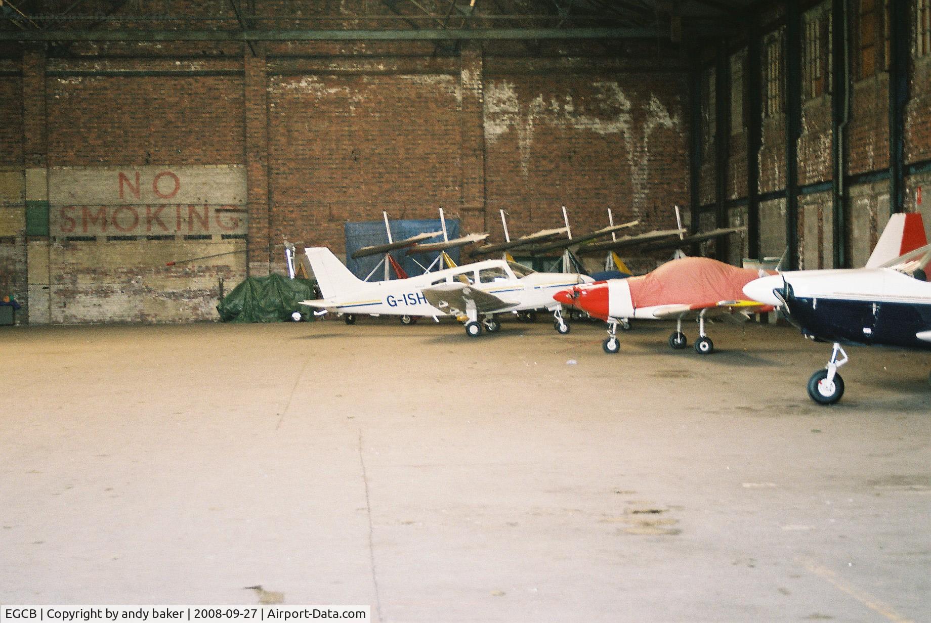 City Airport Manchester, Manchester, England United Kingdom (EGCB) - some aircraft in one of the hangers at barton-uk