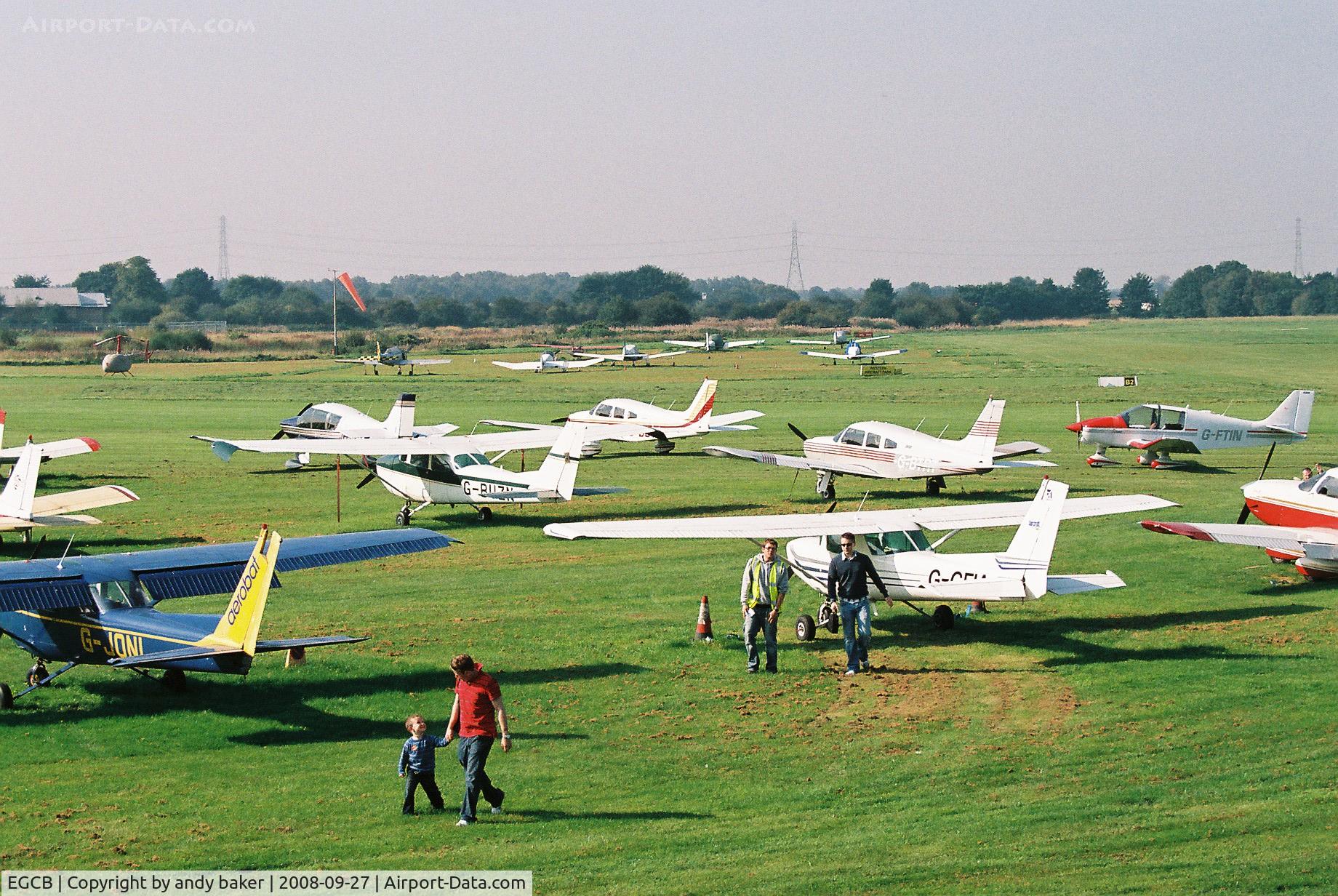City Airport Manchester, Manchester, England United Kingdom (EGCB) - photo taken from the 1st floof atc tower block just some of the aircraft parcked up out on the airfeld 