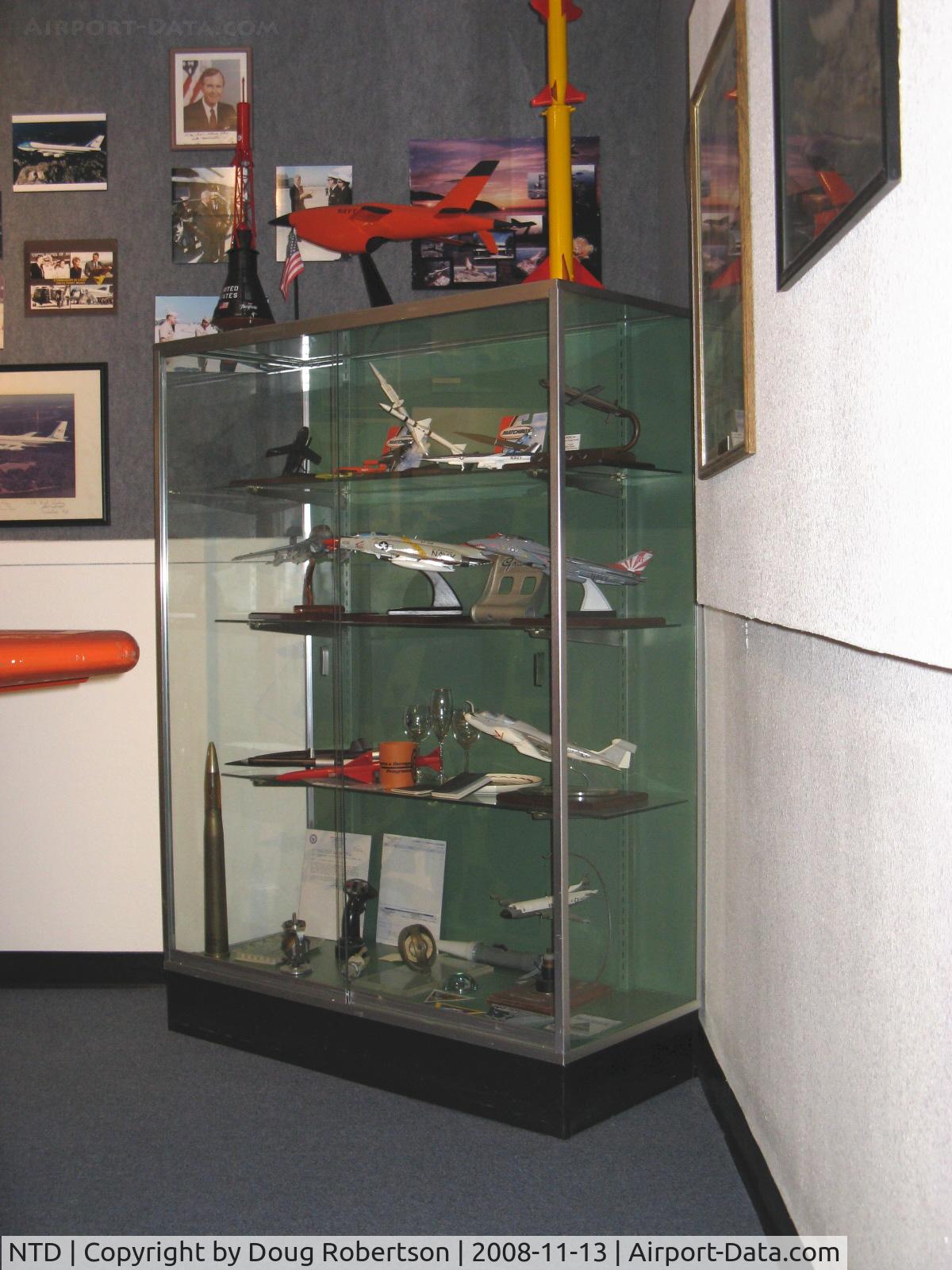 Point Mugu Nas (naval Base Ventura Co) Airport (NTD) - Representative aircraft, targets & missile models in Point Mugu's history. My white Texas Instruments mounted on plaque HARM AGM-88A missile model donation-center top shelf