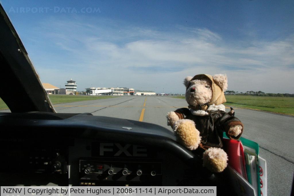 Invercargill Airport, Invercargill New Zealand (NZNV) - Pierre the Pilot, round-the-world bear taxies towards the terminal and tower at Invercargill NZ - see www.bearintheair.org for his story!