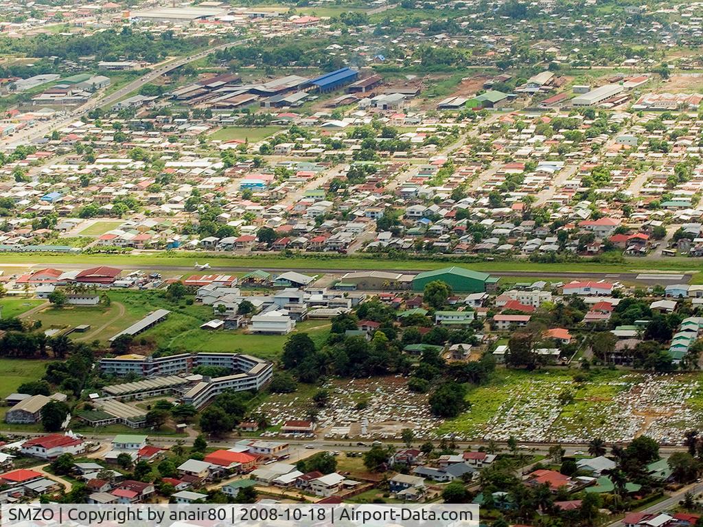 Zorg en Hoop Airport, Paramaribo Suriname (SMZO) - Overview of Zorg en Hoop Airfield as we come in to land RWY 11. A Gum Air aircraft is taxiing to the end getting ready for takeoff.