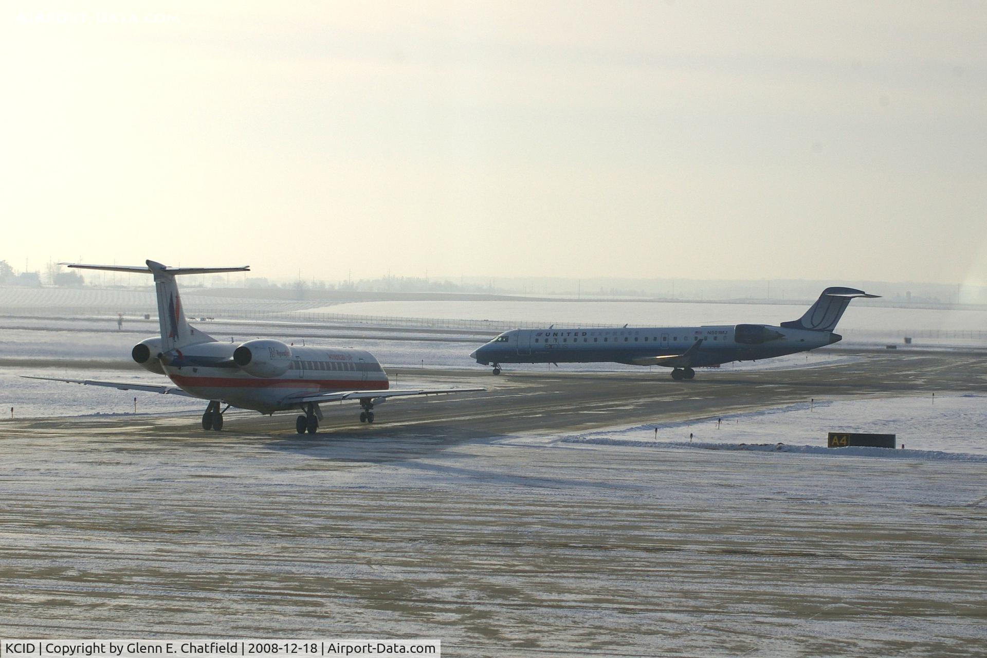 The Eastern Iowa Airport (CID) - American Eagle, N659AE, waits for Skywest, N501MJ to pass.