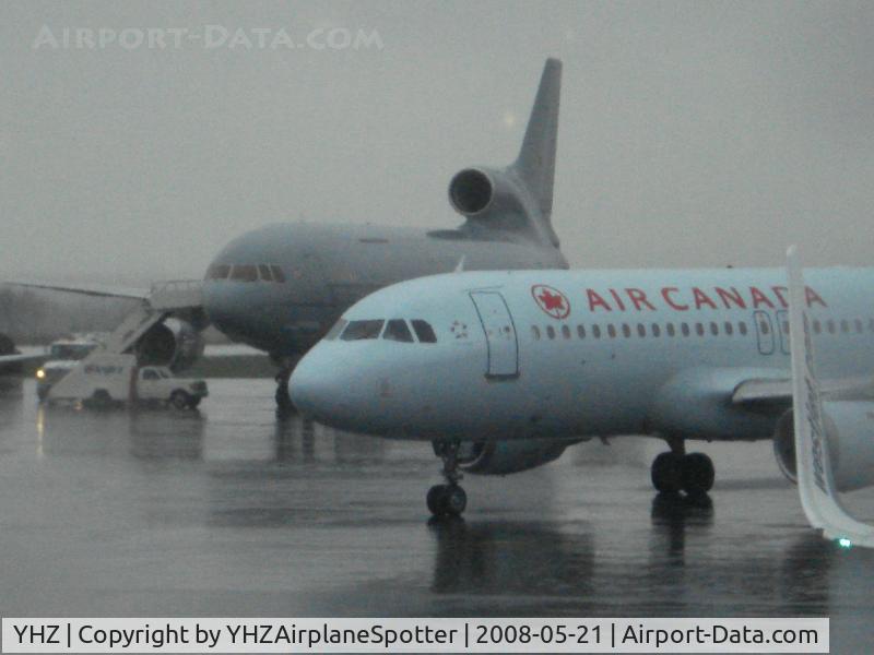 Halifax International Airport, Halifax Regional Municipality, Nova Scotia Canada (YHZ) - Another picture of the RAF Tristar as an Air Canada aircraft taxis to the gate at YHZ