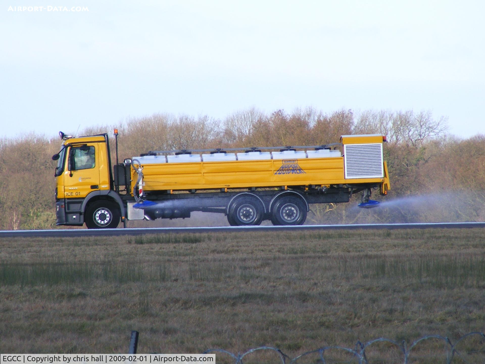 Manchester Airport, Manchester, England United Kingdom (EGCC) - Spraying deicer on the runway 