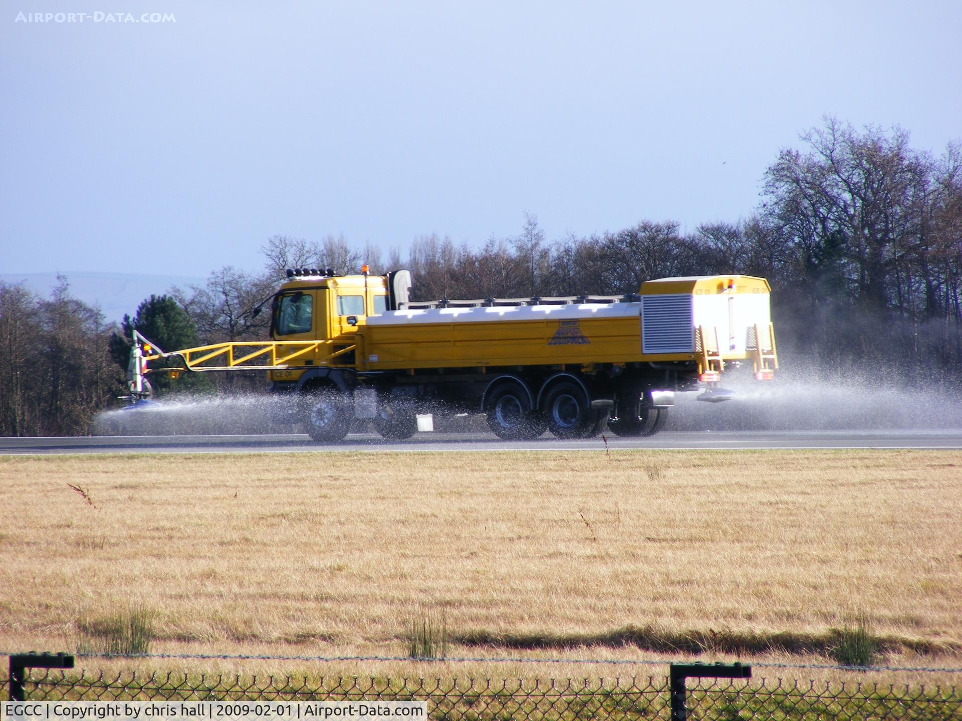 Manchester Airport, Manchester, England United Kingdom (EGCC) - Spraying deicer on the runway 