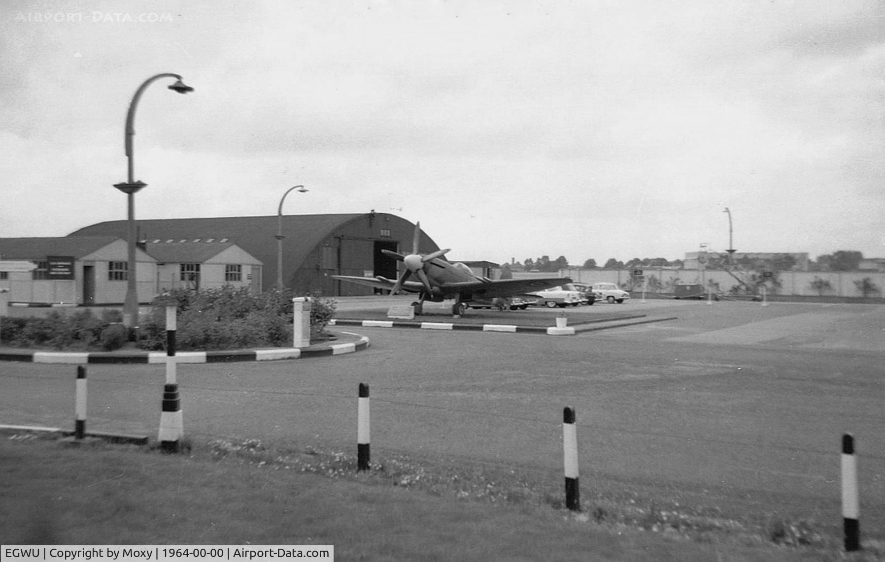 RAF Northolt Airport, Ruislip, England United Kingdom (EGWU) - Old entrance to Northolt on the A40 Western Avenue with Spit F22 PK624 on gate guard duties. Entrance now closed. 