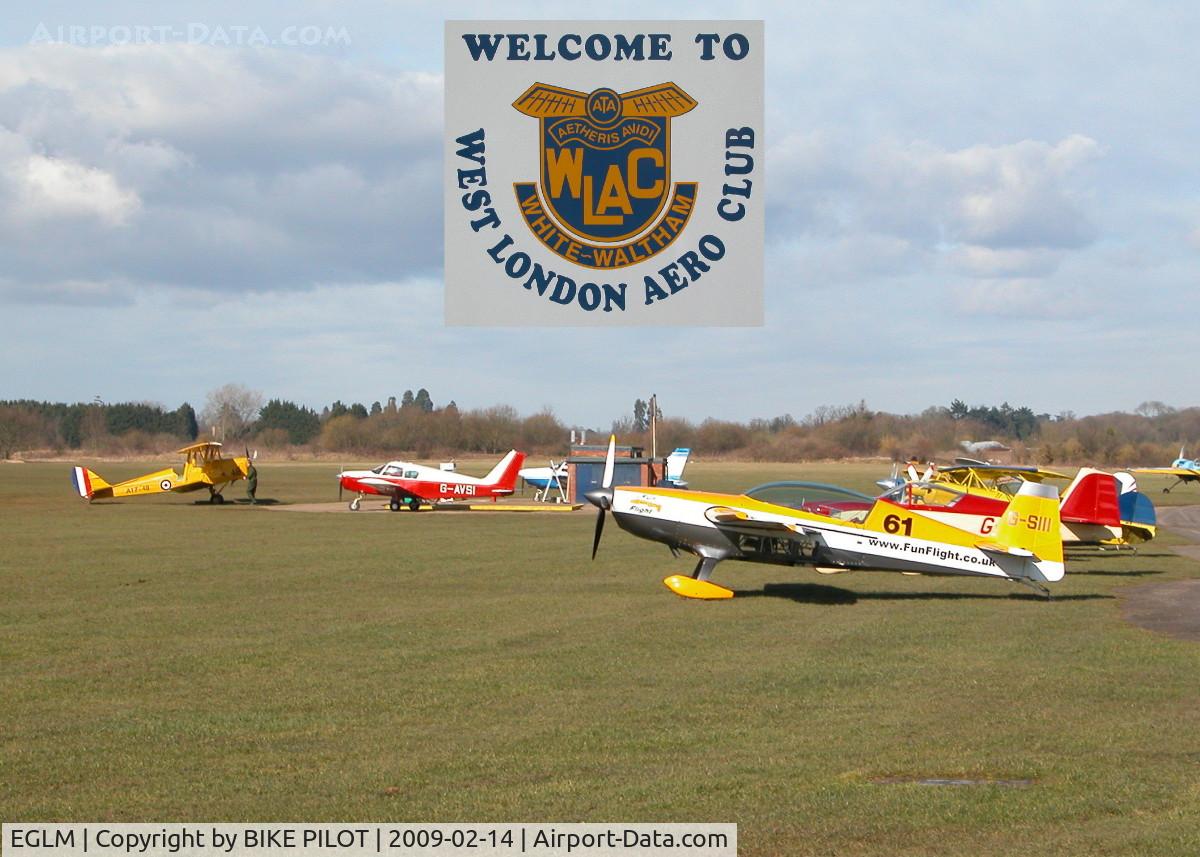 White Waltham Airfield Airport, White Waltham, England United Kingdom (EGLM) - FUEL PUMPS AT CENTRE WITH AN EXTRA EA 300 IN THE FORGROUND, ONE OF A LARGE NUMBER OF AEROBATIC A/C BASED HERE.