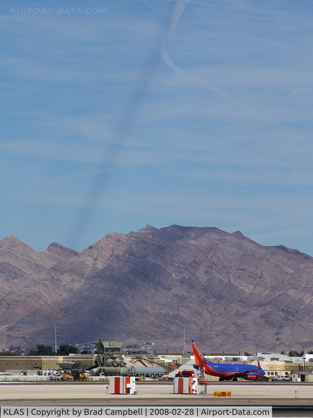 Harry Reid International Airport (LAS) - Contrail shadow being cast on Sunrise Mountain