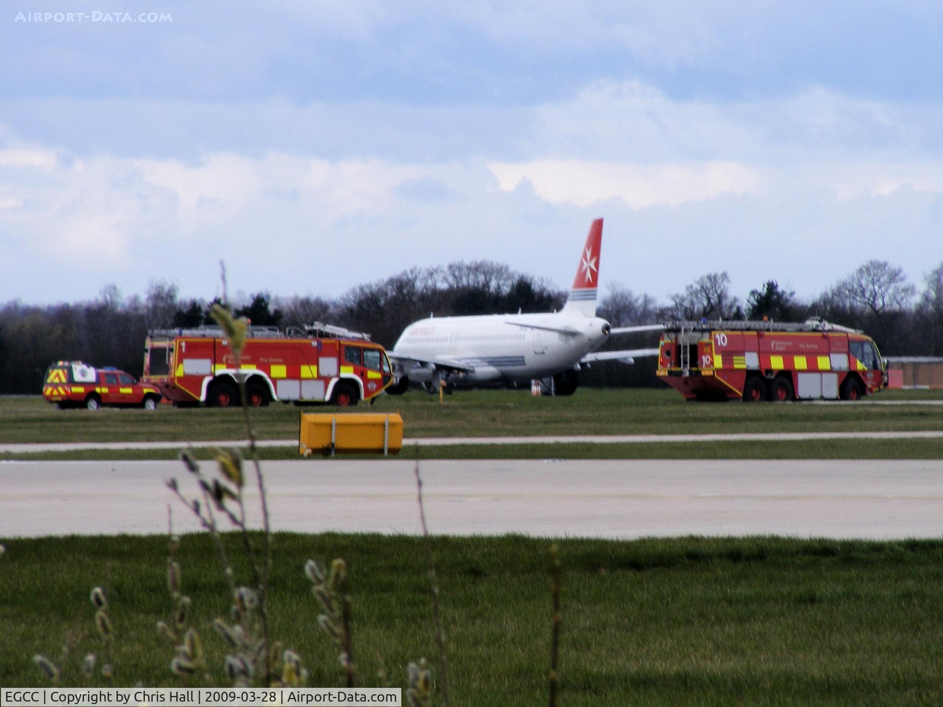 Manchester Airport, Manchester, England United Kingdom (EGCC) - Air Malta A319 9H-AEI made an emergency landing with all the fire trucks in attendance