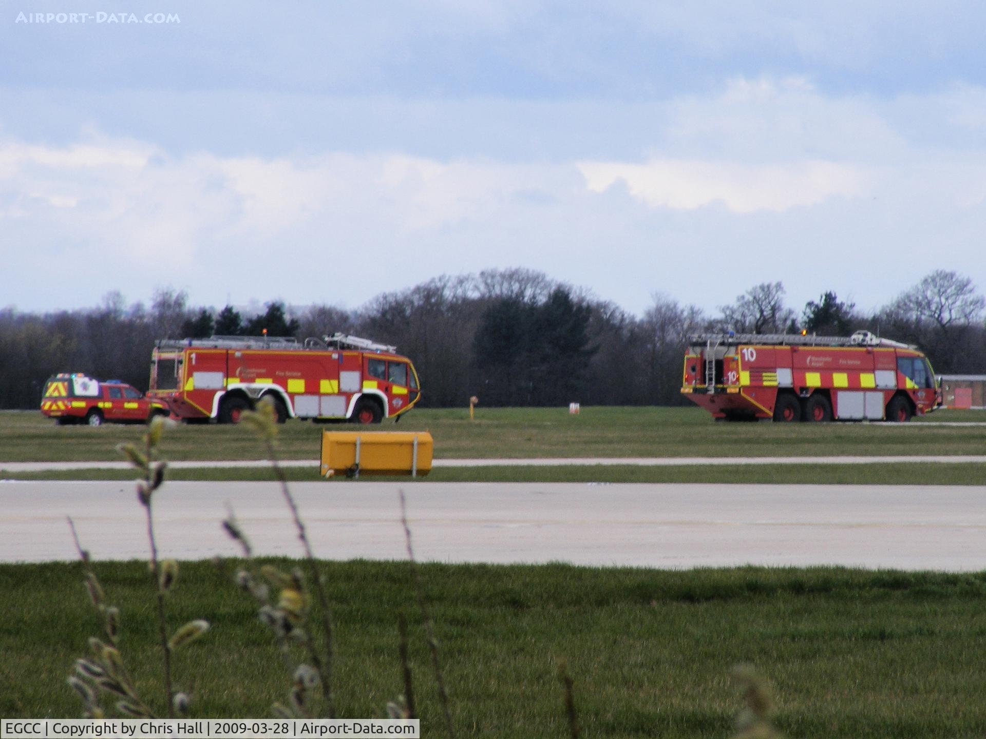 Manchester Airport, Manchester, England United Kingdom (EGCC) - Fire trucks waiting for Air Malta A319 9H-AEI which made an emergency landing 