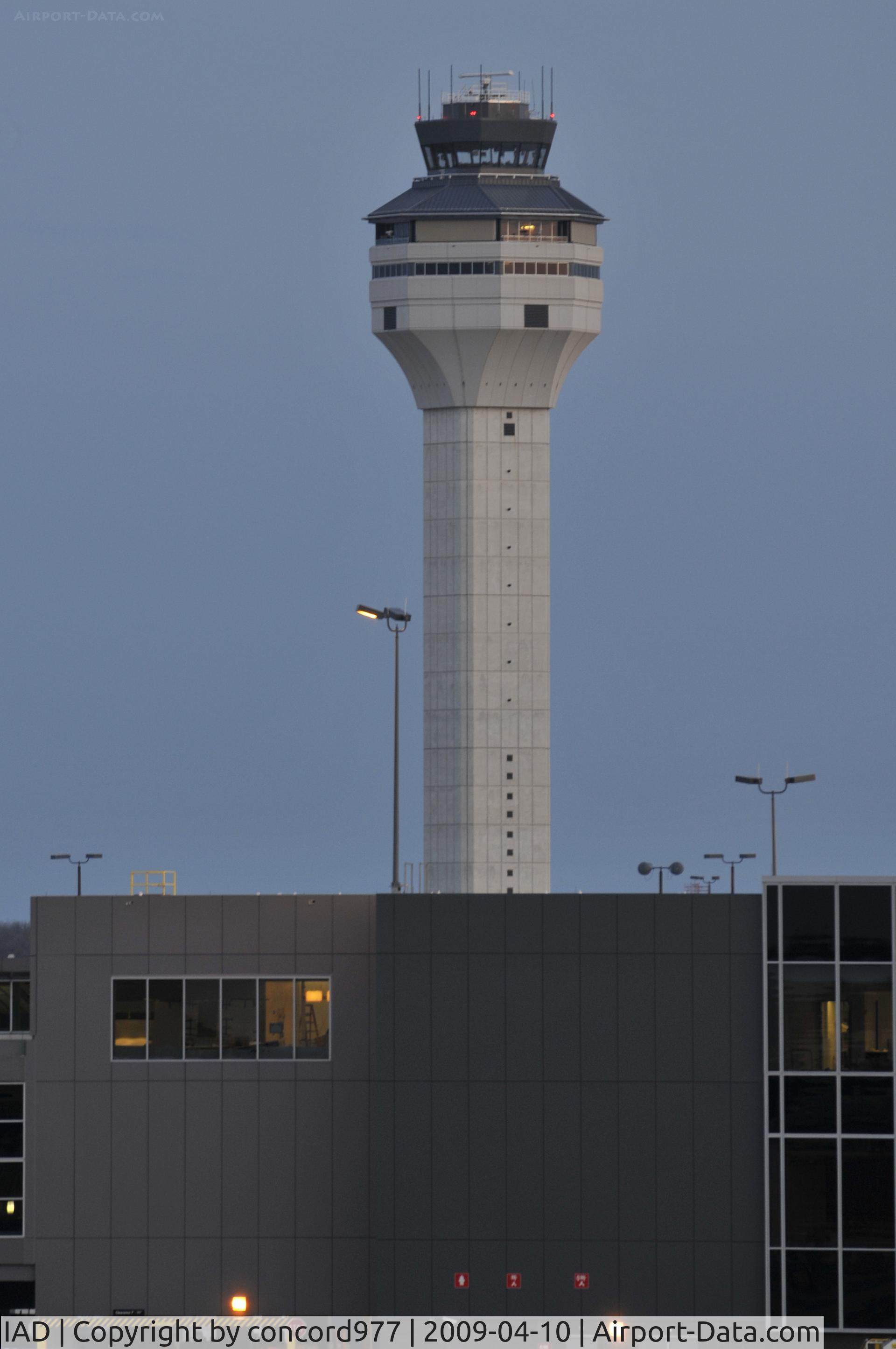 Washington Dulles International Airport (IAD) - The new tower lacks the elegance of the original terminal building and old tower.