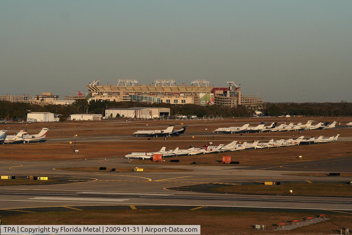 Tampa International Airport (TPA) - Aircraft in for the Superbowl, Raymond James Stadium (where Superbowl was played) in background