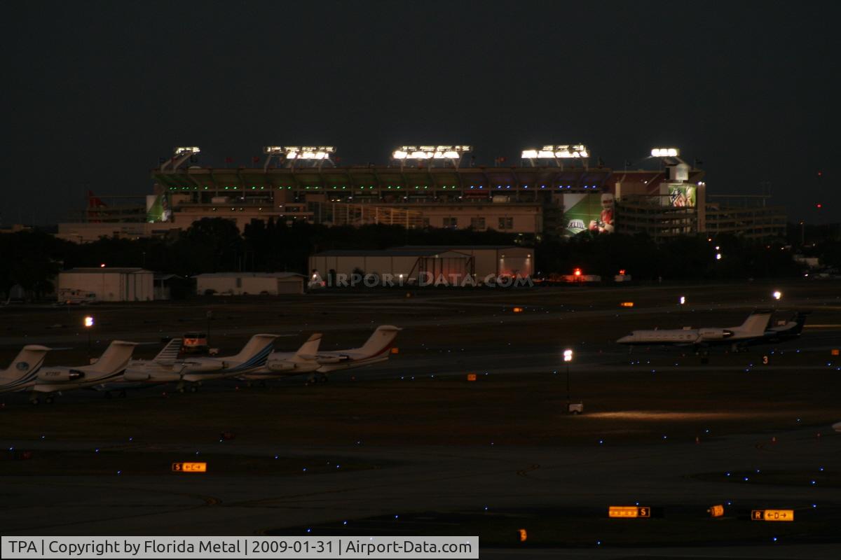 Tampa International Airport (TPA) - Night view of Tampa ramp and Raymond James Stadium