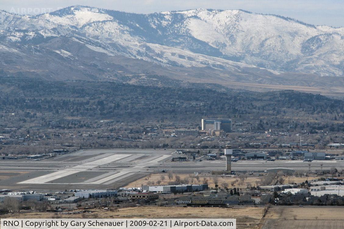 Reno/tahoe International Airport (RNO) - Reno-Tahoe International's runway 25-7 intersects with parallel runways 16L-34R and 16R-34L in this photo taken from the Virginia Range mountains east of the airport.
