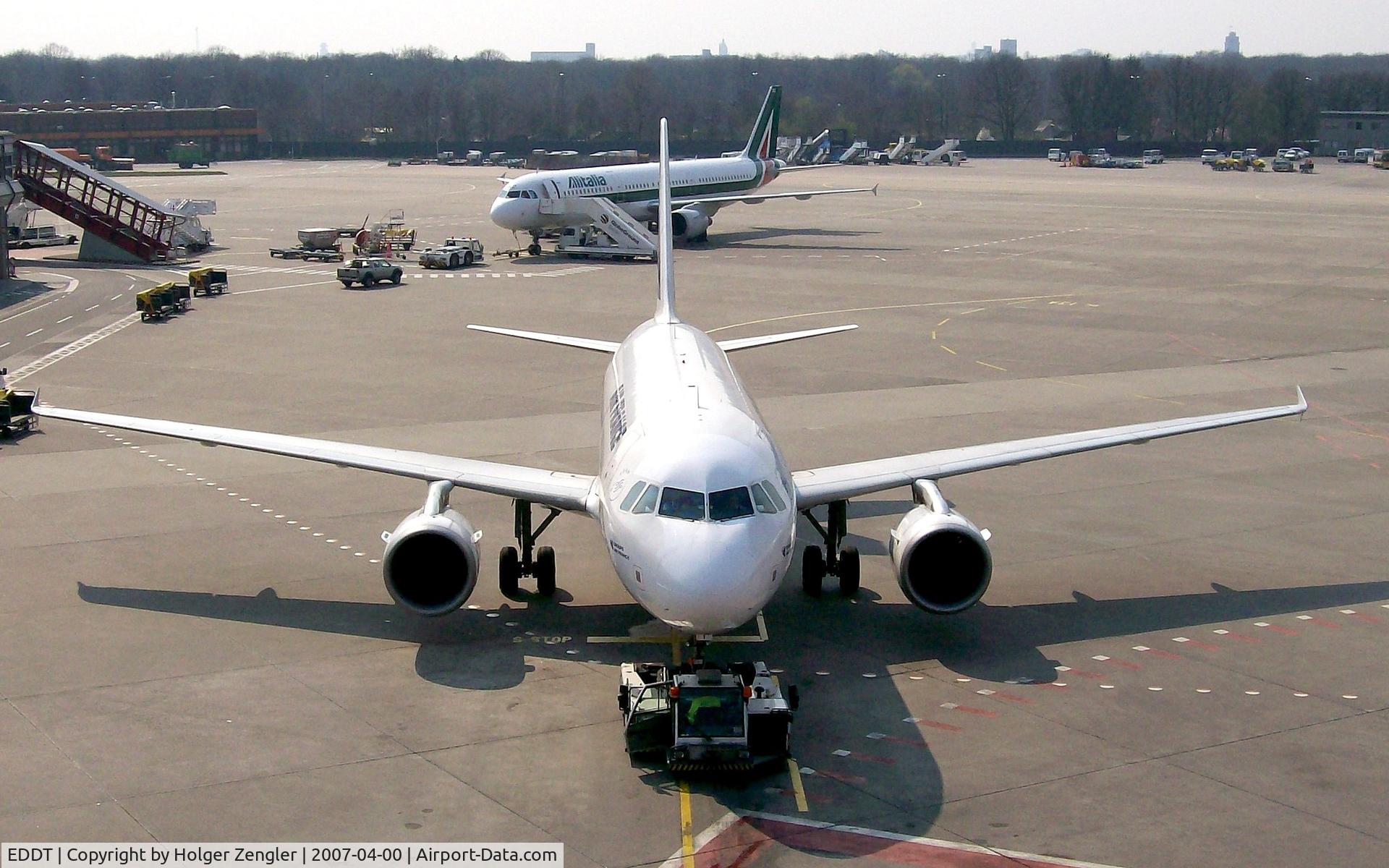 Tegel International Airport (closing in 2011), Berlin Germany (EDDT) - An Airbus of Air France is pushed out of parking position at gate 14
